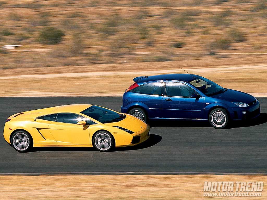 112_0408_Ford_Racing_Focus_RS8_Vs_Lamborghini_Gallardo_17z-Ford_Racing_Focus_RS8_And_Lamborghini_Gallardo-Passenger_Side_View_Racing.jpg